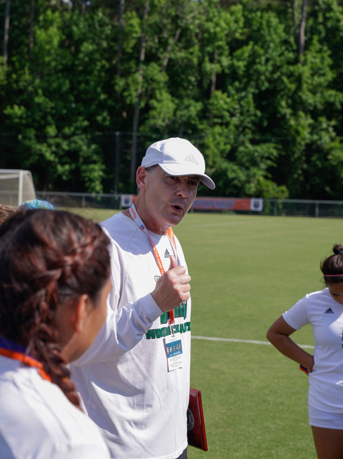 Woods Charter's longtime head coach Graeme Stewart speaks to his team following the Wolves' 3-0 loss to the Crusaders in the 1A state title game last Saturday in Cary.